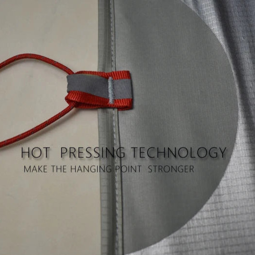 Red string with a knot tied to gray fabric, highlighting hot pressing technology.
