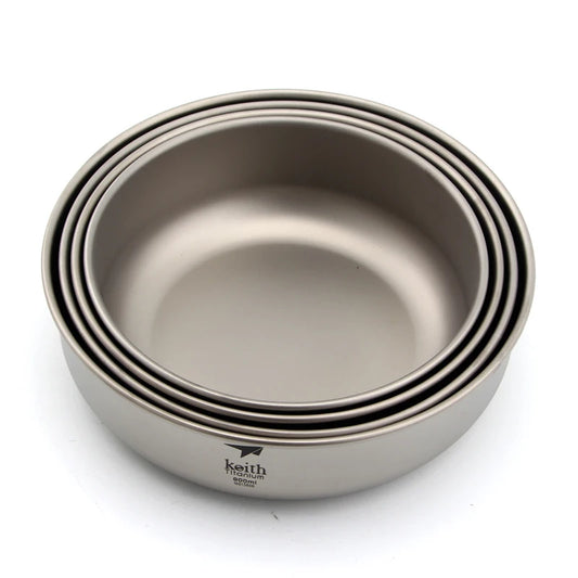 Set of titanium bowls stacked on a white background