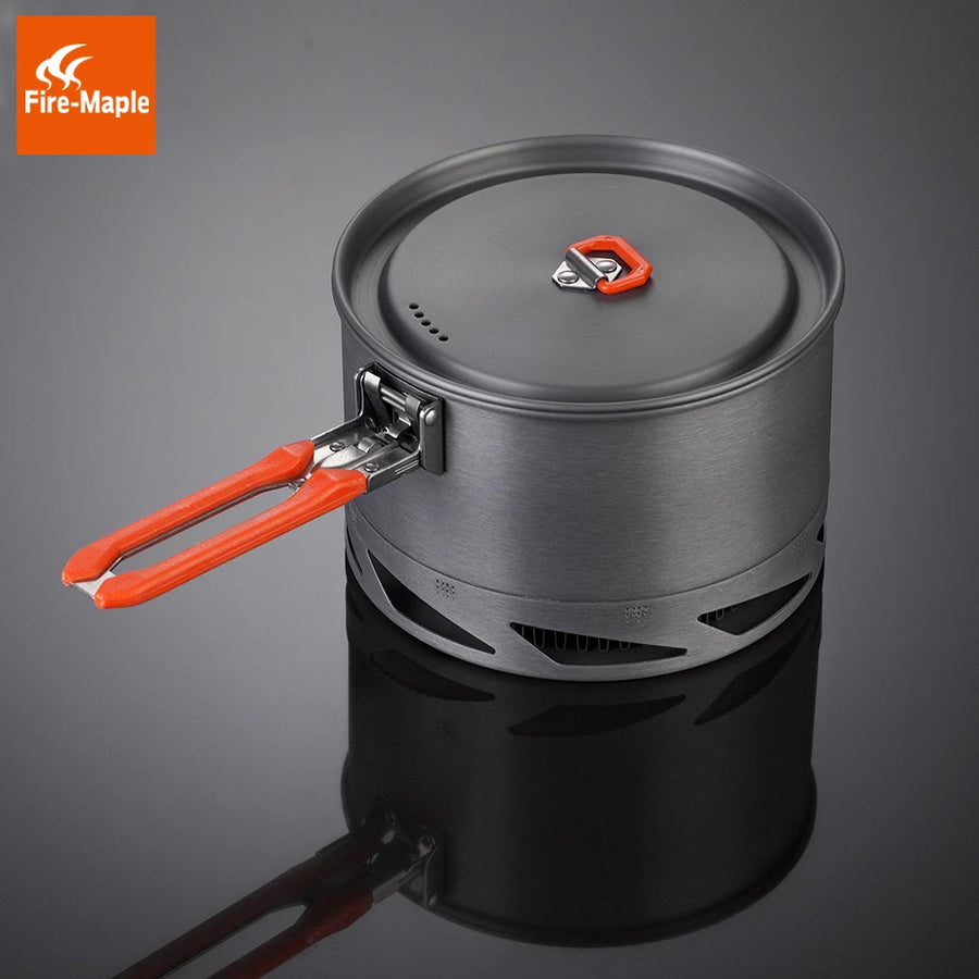 Portable camping stove with red handles and Fire-Maple logo on a dark background