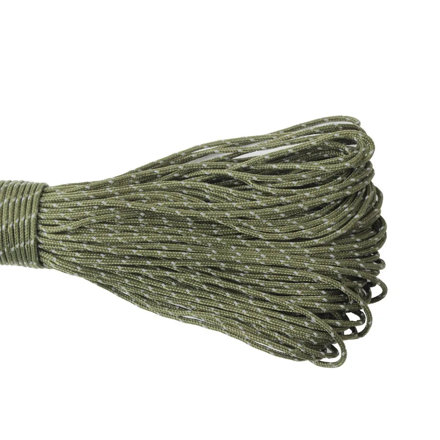 Coiled green paracord on a white background