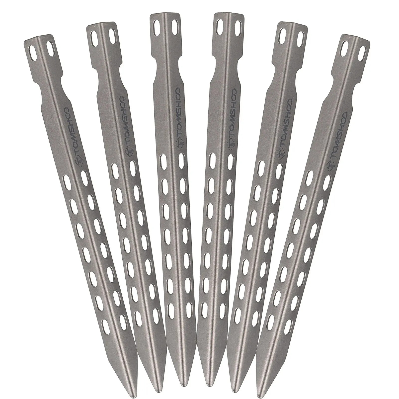 Set of six titanium tent stakes on a white background