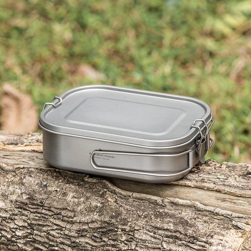 Metal food container on a tree branch with a natural background
