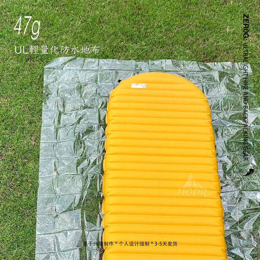 Yellow inflatable mattress on a green grass background with text and branding.