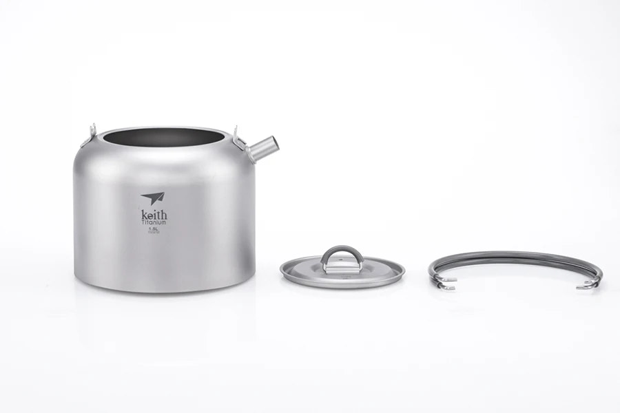 titanium kettle with lid and handle on a white background
