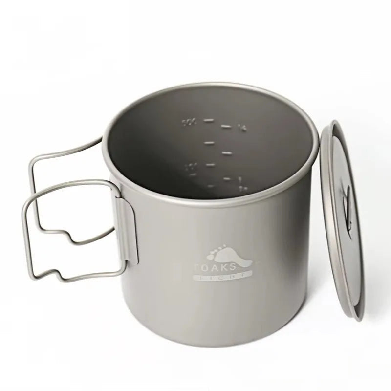 titanium camping mug with lid on a white background