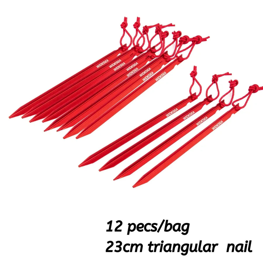 Red triangular nails with rope handles on a white background