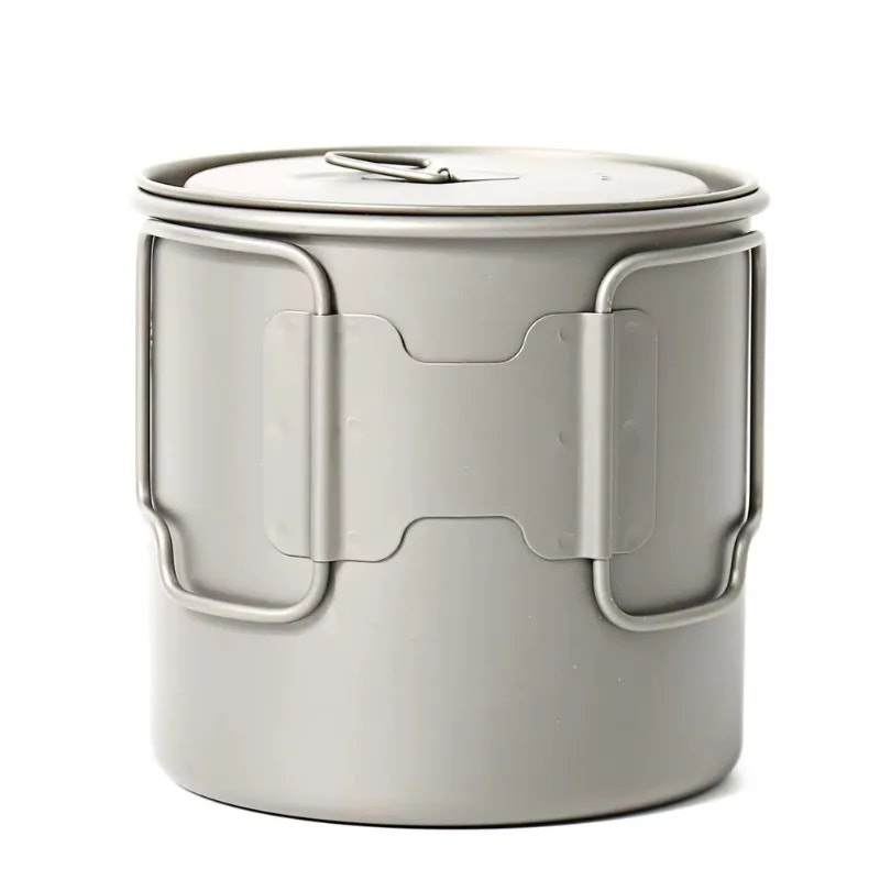 Gray metal camping pot with a lid on a white background