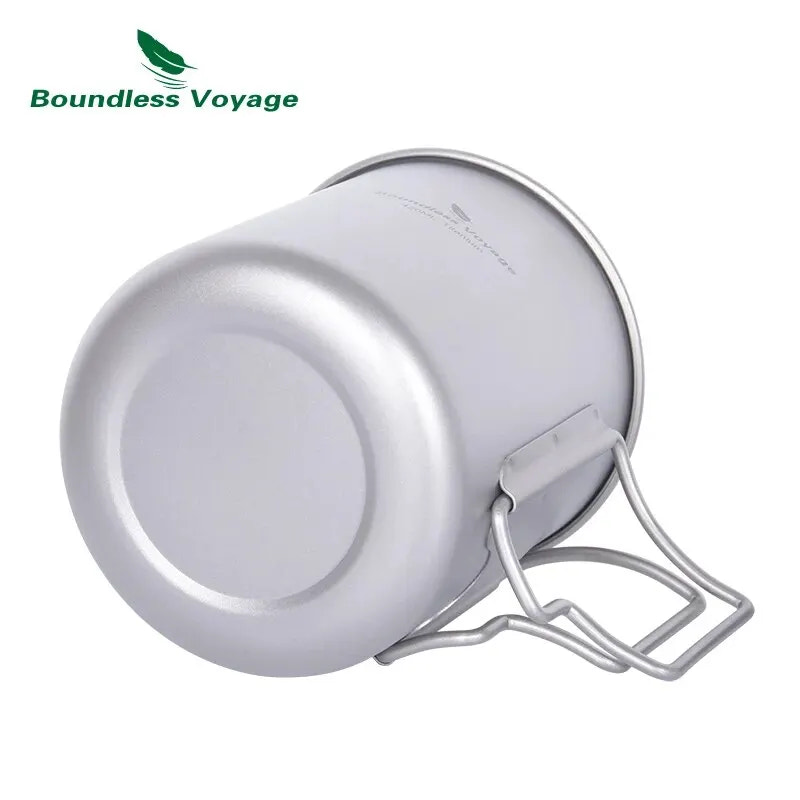 Metal camping mug with handle on a white background, featuring 'Boundless Voyage' brand.