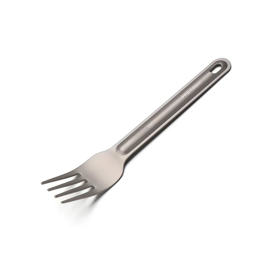 Metallic fork with a handle on a white background