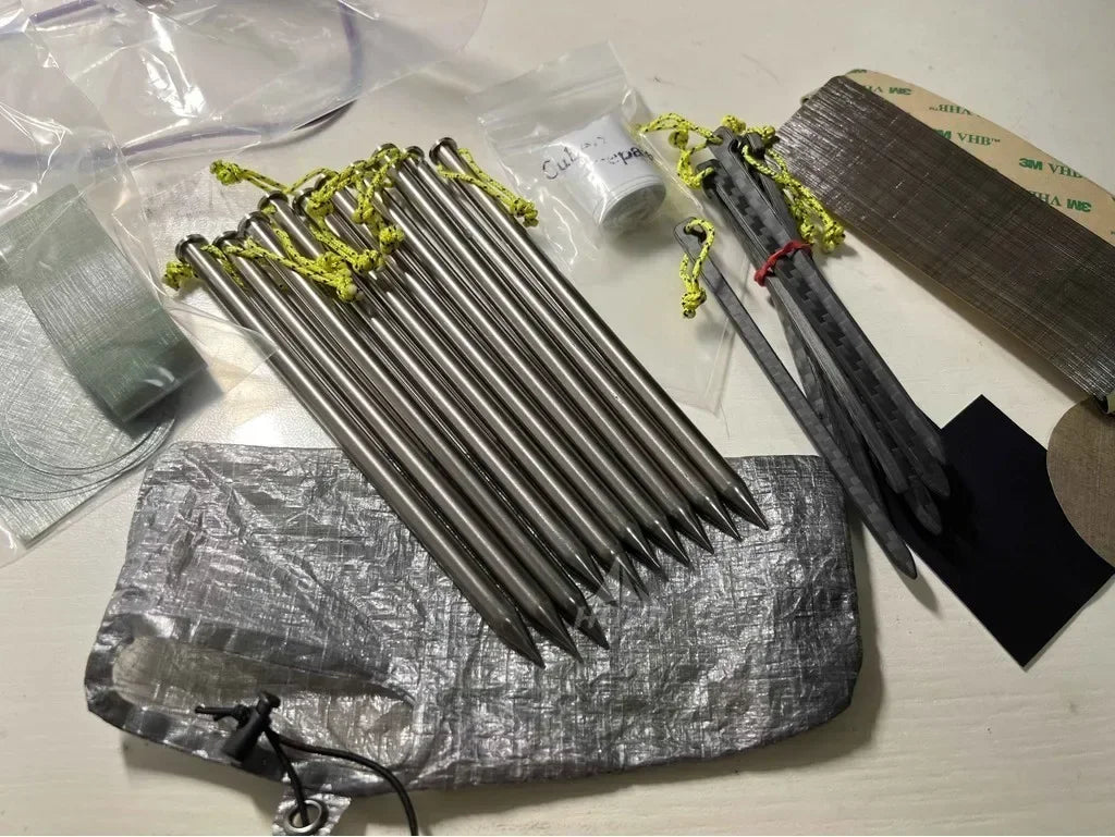 Set of metal rods with a drawstring bag on a light surface
