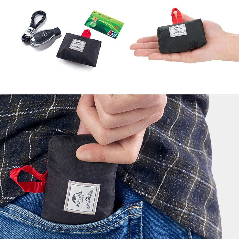 Black compact bag with red handle held by a hand, placed in a pocket, and shown with a keychain and card on a white background.