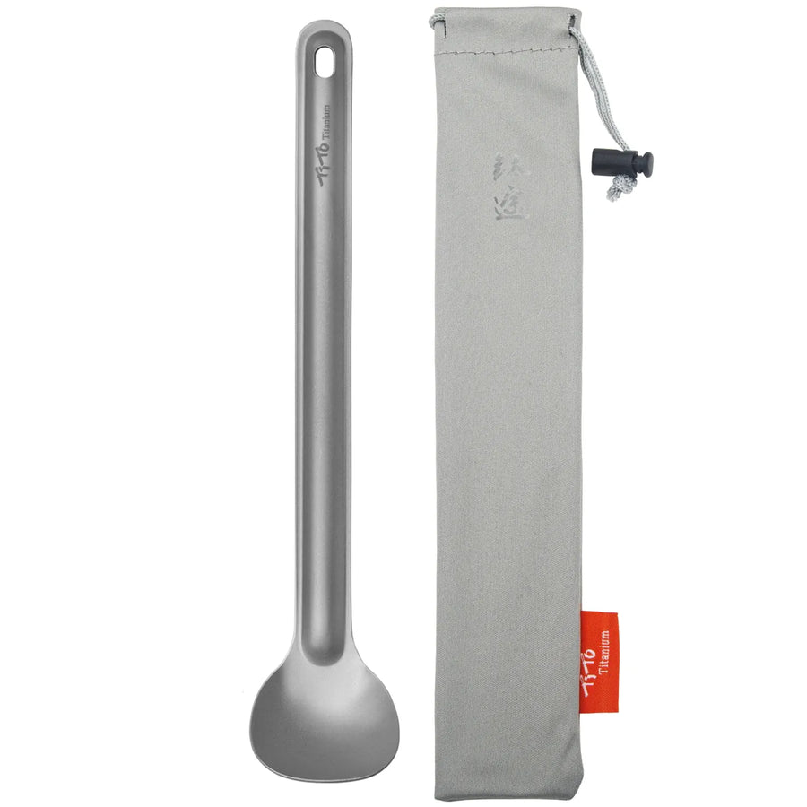 grey spoon with a gray carrying case on a white background