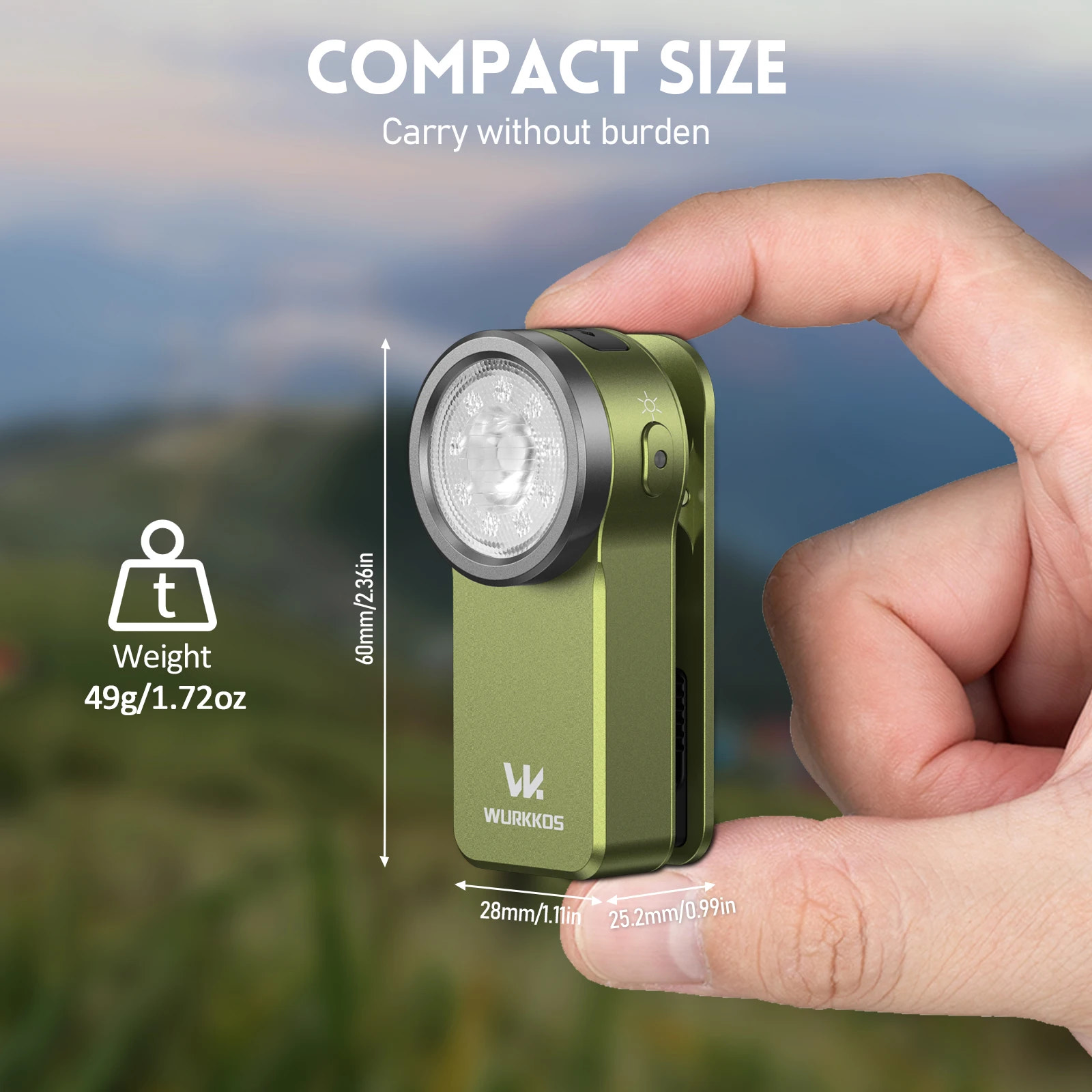 Green flashlight held in a hand with scenic background, highlighting compact size and weight.