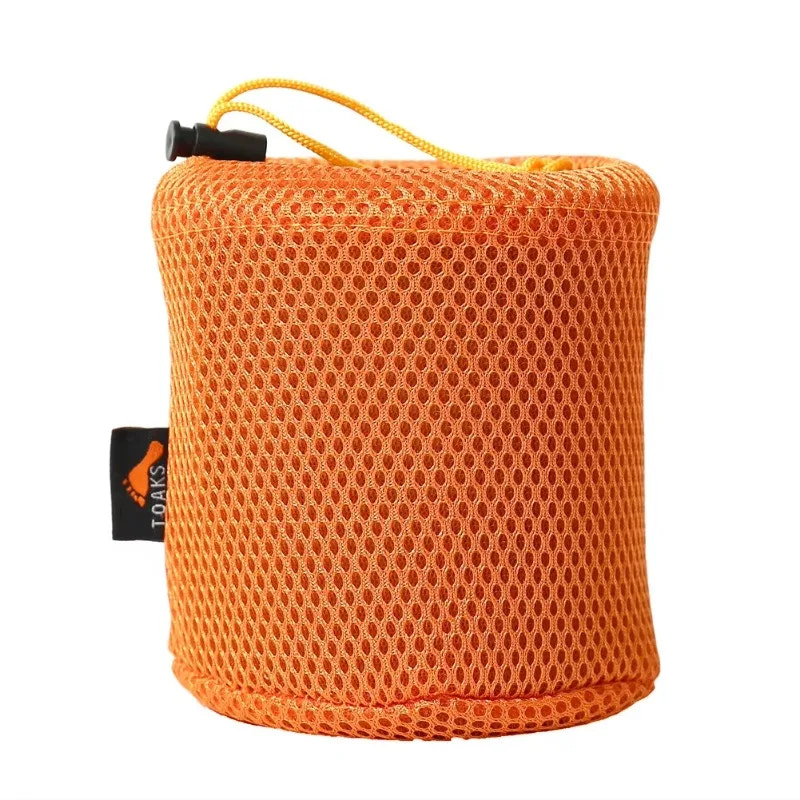 Orange mesh pouch with a black tag on a white background