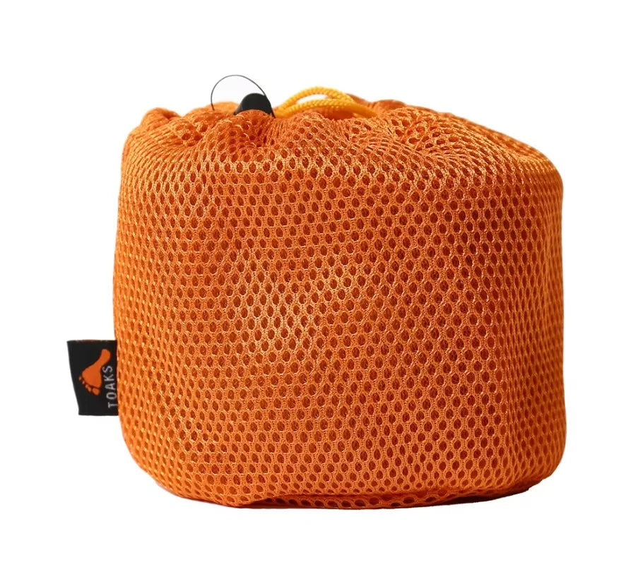 Orange mesh bag with a visible brand tag on a white background