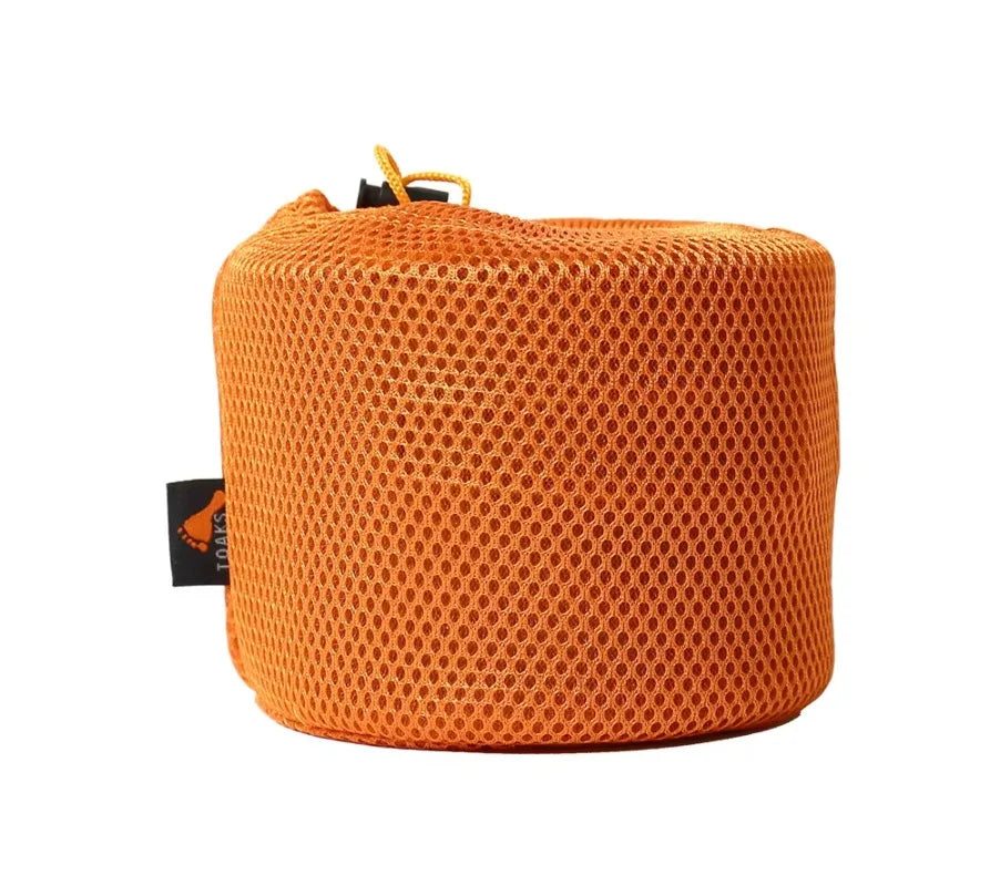 Orange mesh storage bag with a brand tag on a white background