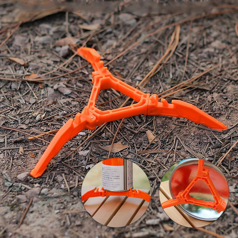 Orange tool with multiple prongs on a ground surface