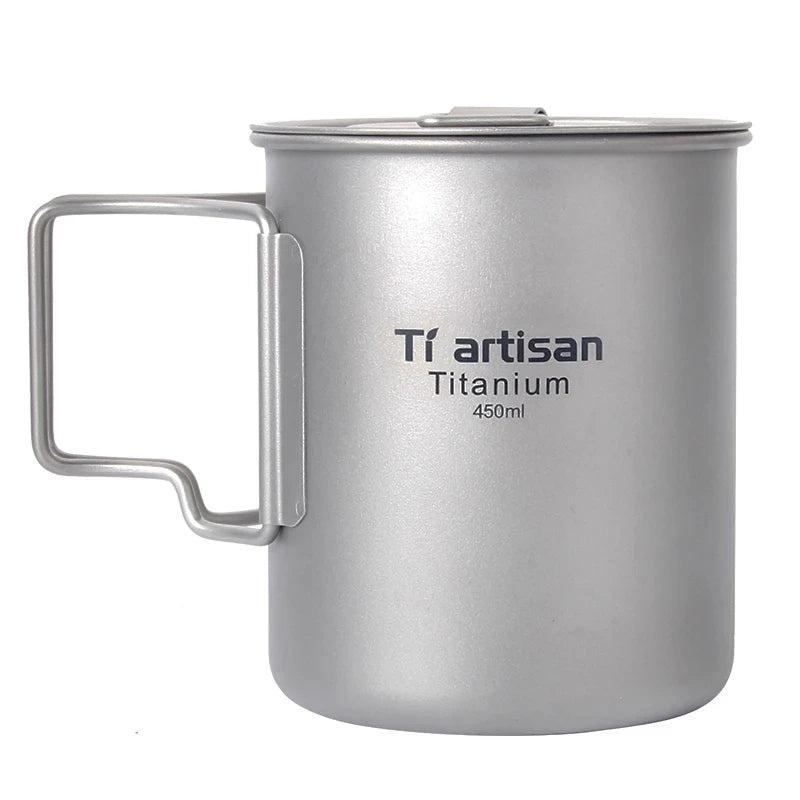 Titanium mug with handle and 'Ti artisan' branding on a white background