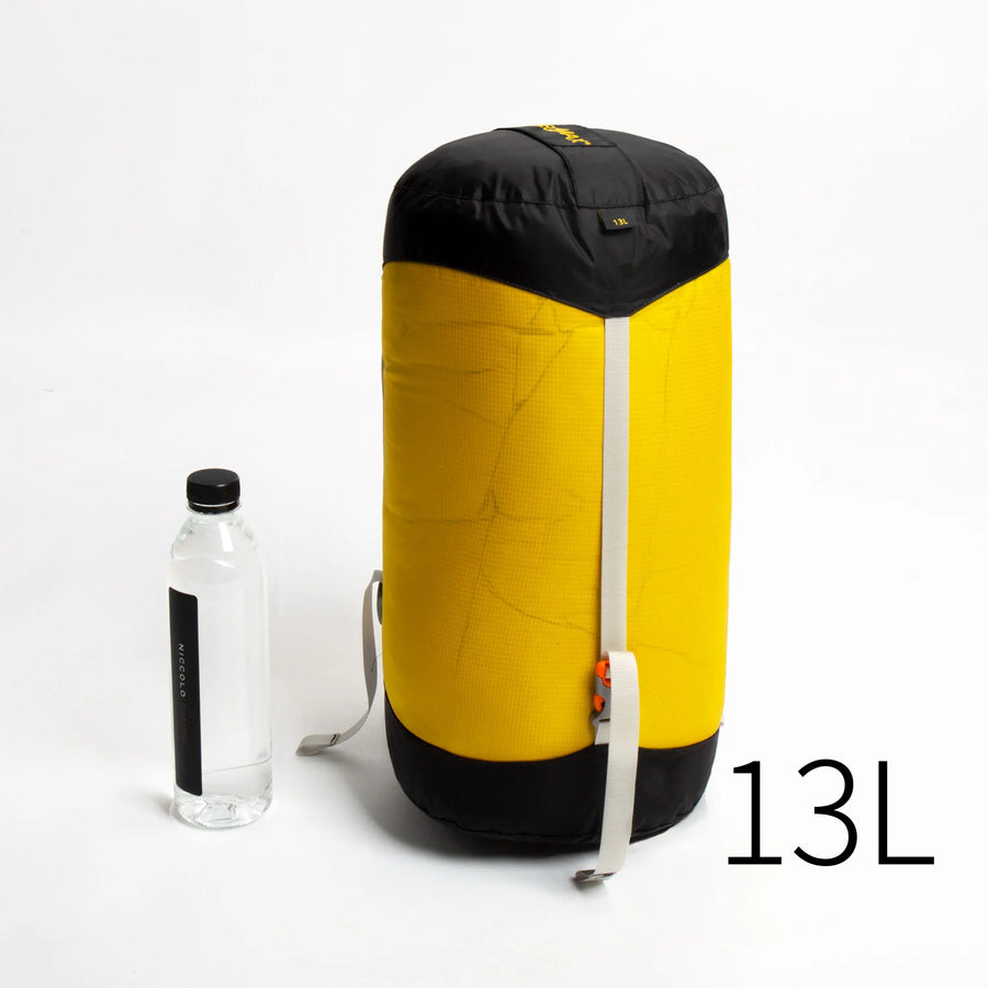 Yellow and black bag (13L) with a water bottle on a white background