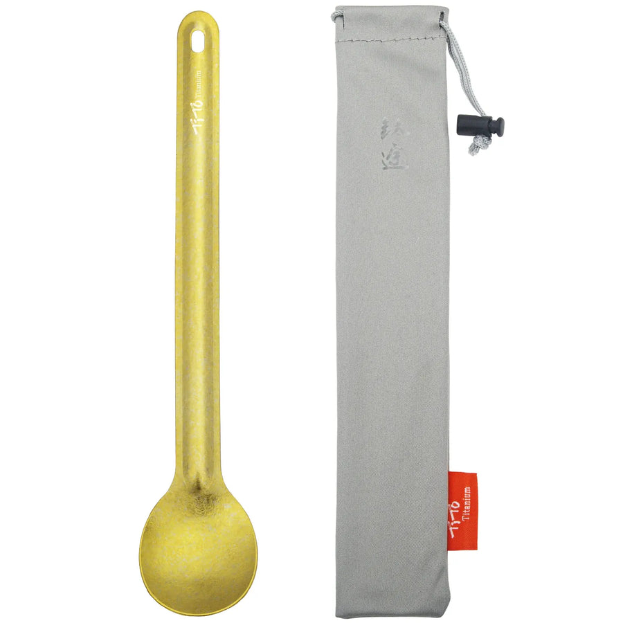 Yellow spoon with a gray pouch on a white background