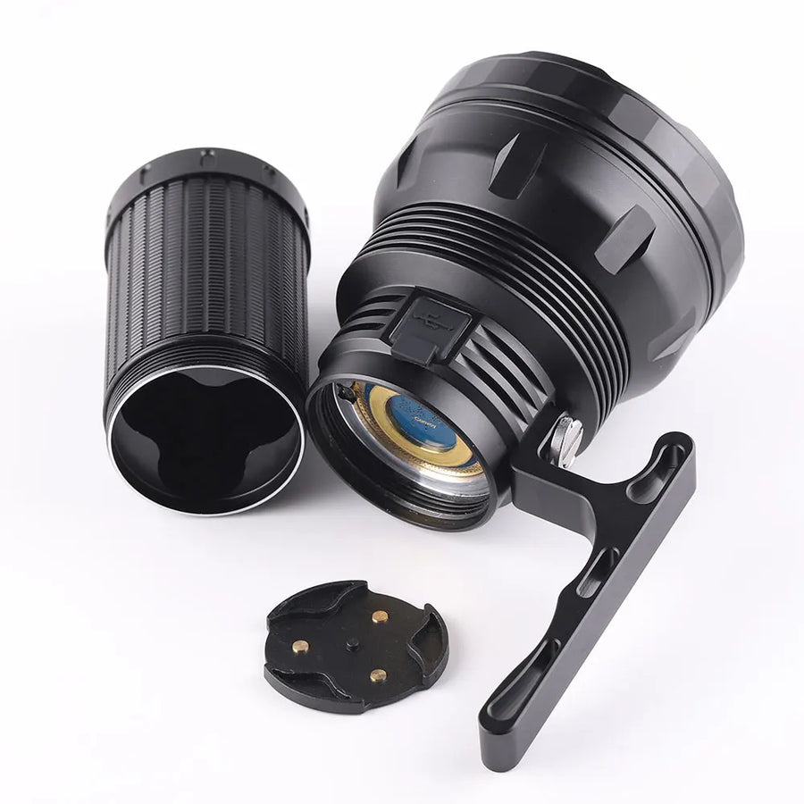 Black flashlight with attachments on a white background
