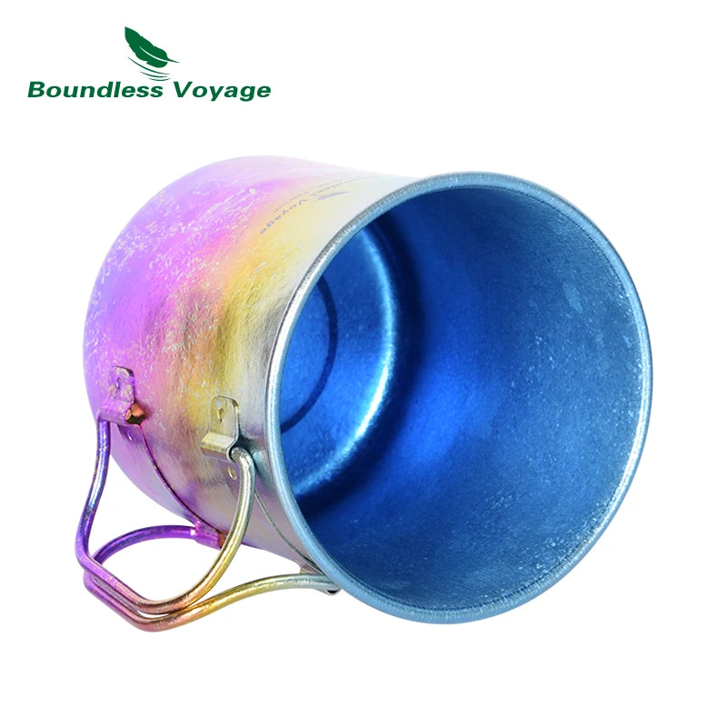 Metal cup with rainbow handle on a white background, branded 'Boundless Voyage'.