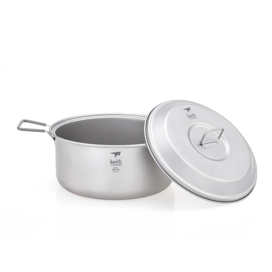 Camping pot with lid on a white background