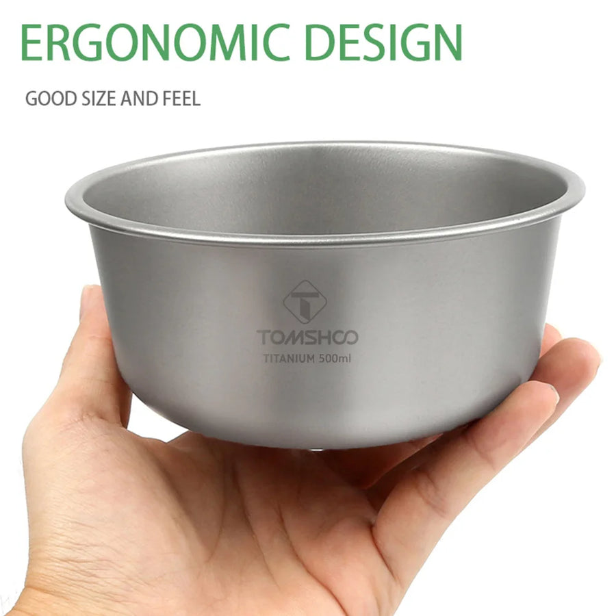 Hand holding a titanium bowl with TOMSHOO branding on a white background