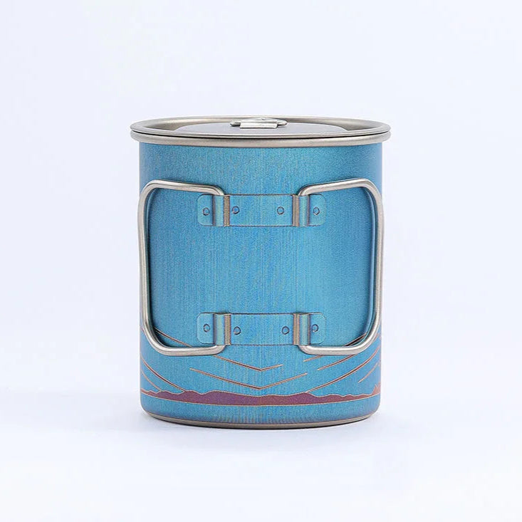 Blue metal cup with silver handles on a white background