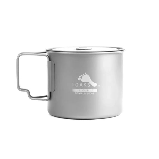 Silver titanium mug with handle on a white background