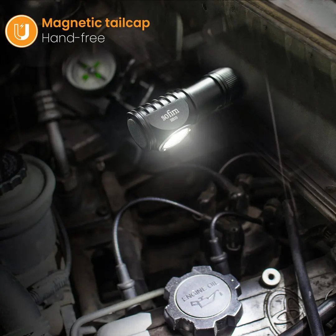 Flashlight illuminating a car engine with 'Magnetic tailcap' text overlay