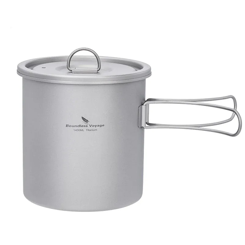 Titanium camping pot with handle and lid on a white background
