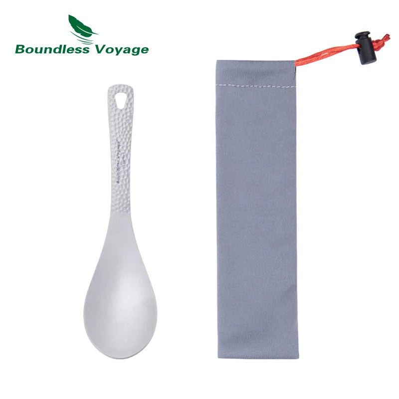 White spoon with textured handle and gray pouch on a white background, featuring 'Boundless Voyage' brand.
