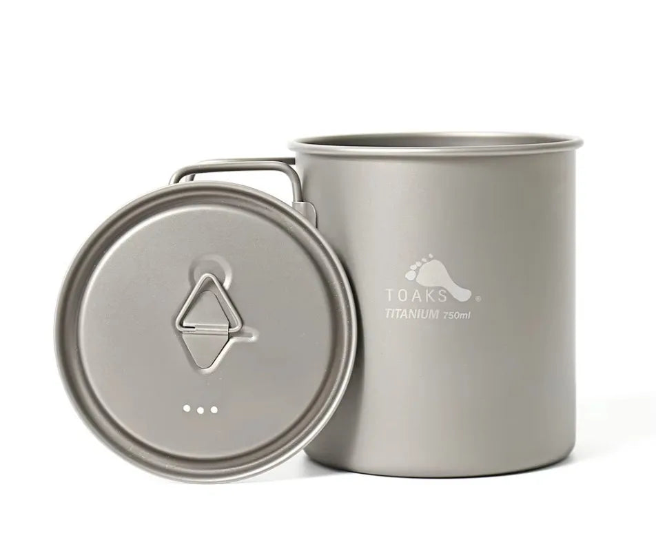 Titanium mug with lid on a white background