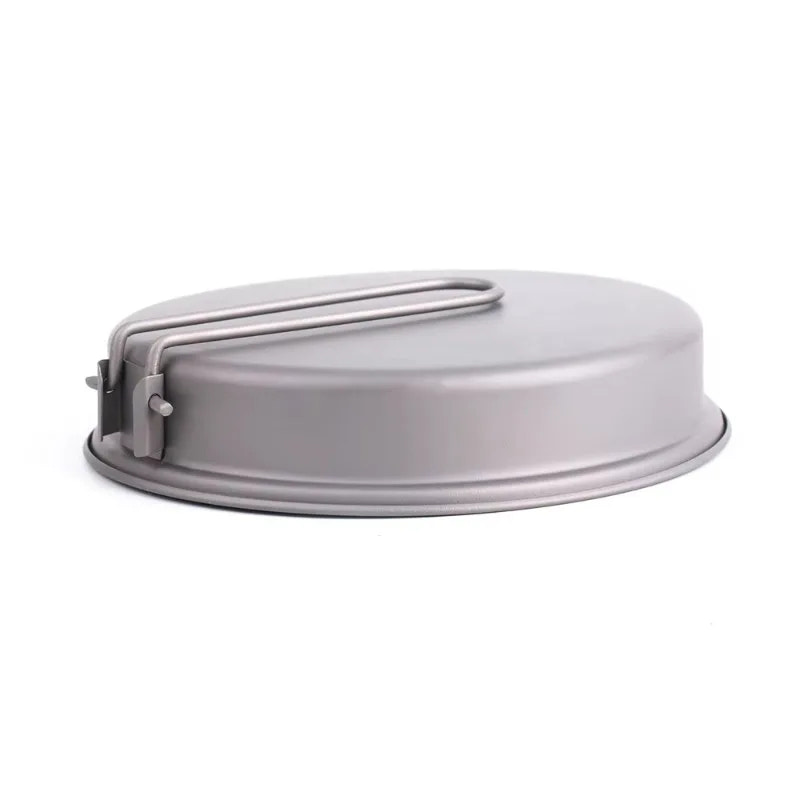 Gray metal frying pan with a handle on a white background