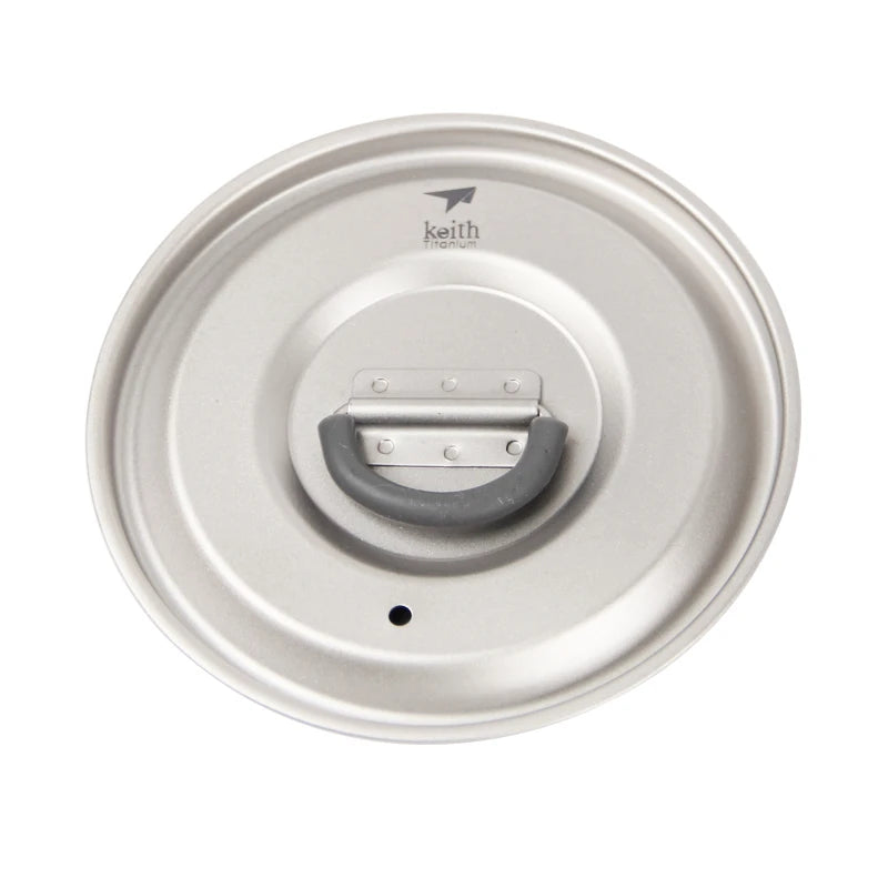 Metallic lid with a handle on a white background