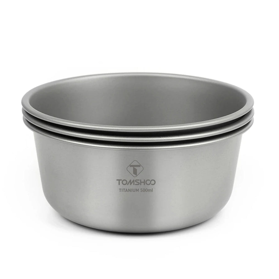 Set of three titanium bowls with Tomschoo branding on a white background