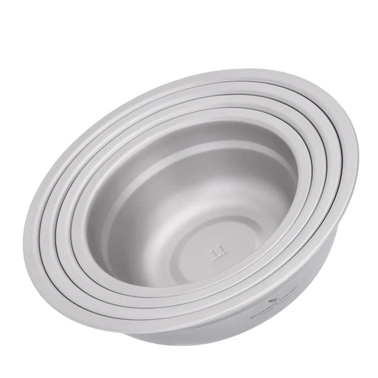 Set of titanium bowls stacked on a white background