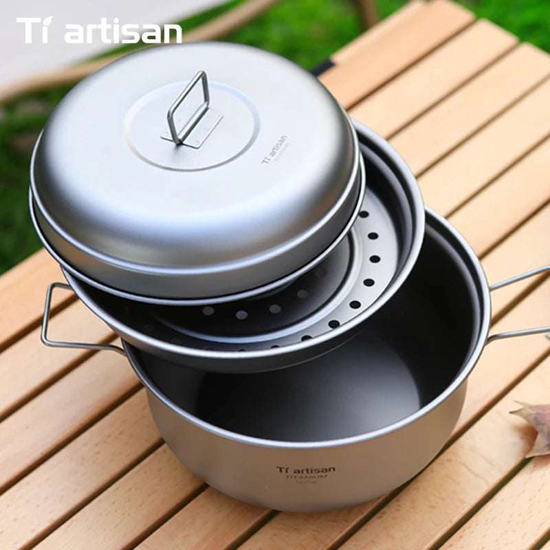 Stack of titanium cookware with lids on a wooden surface, featuring the Tiartisan brand.