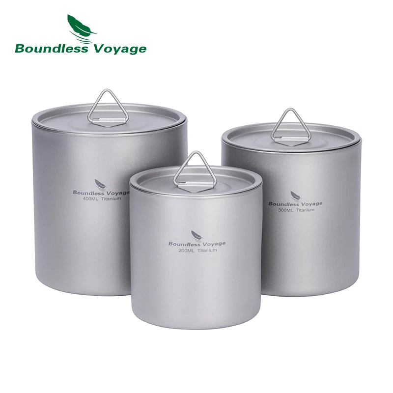 Three silver camping pots with lids on a white background, featuring the Boundless Voyage brand.