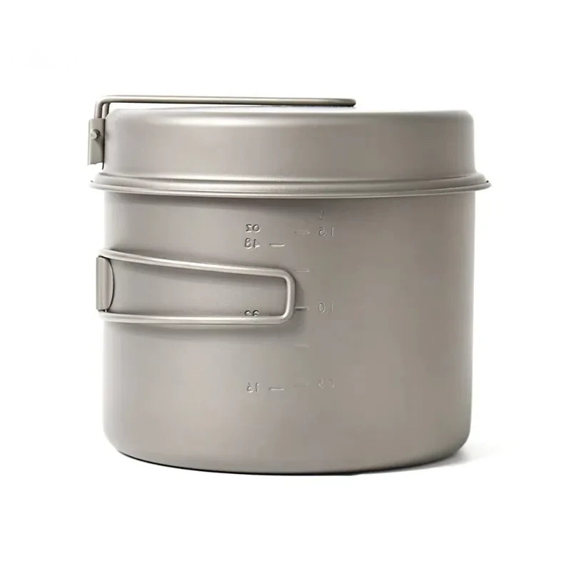 Metal camping pot with handles on a white background