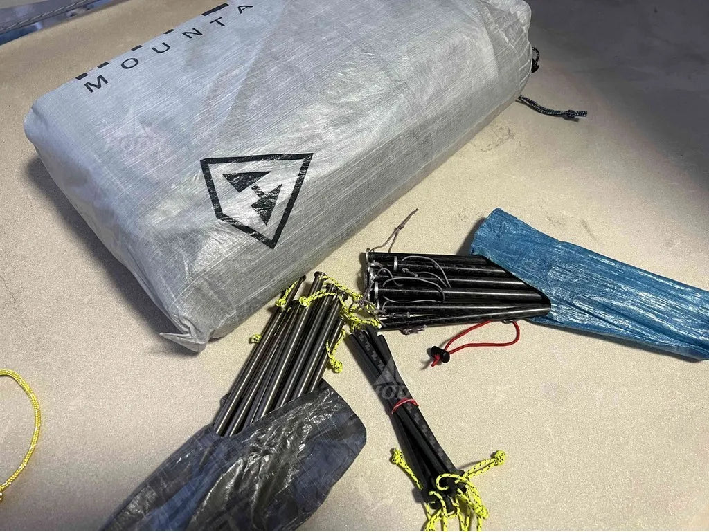 Mounting hardware with straps and a warning label on a concrete surface