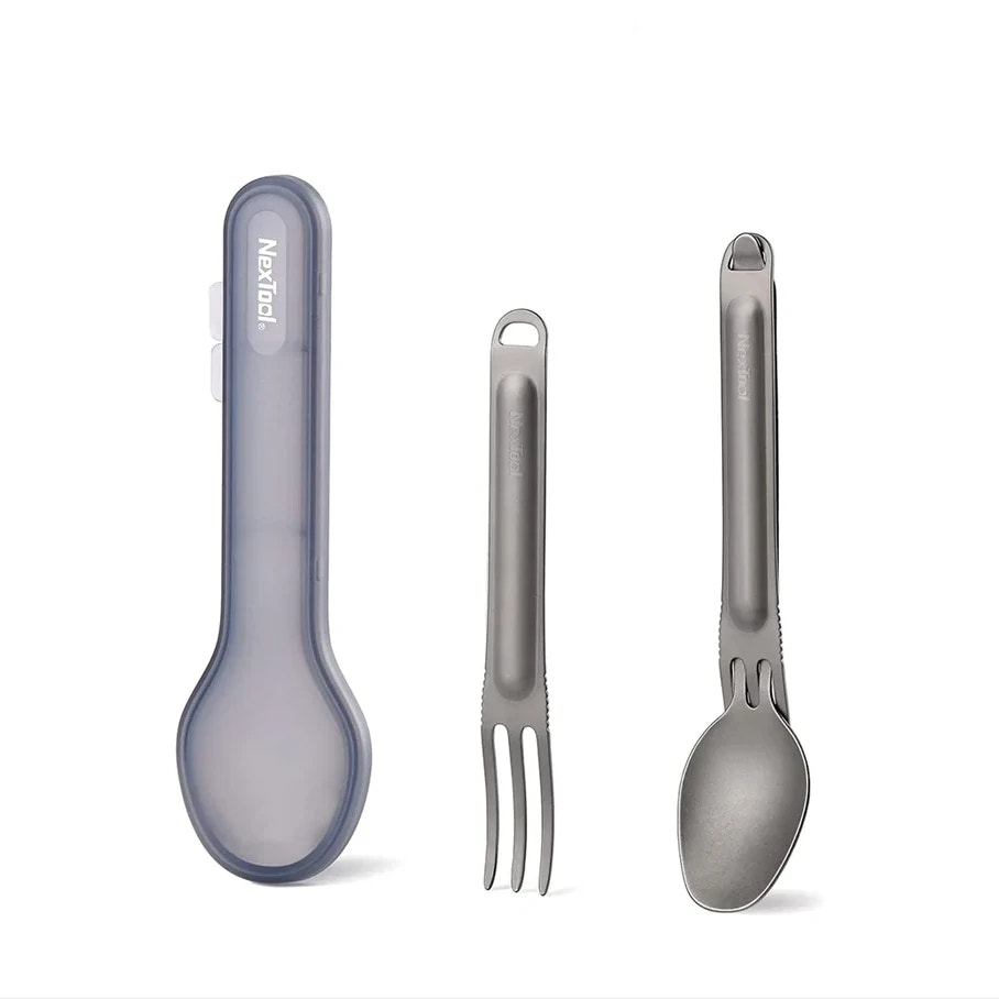 Set of three utensils including a spoon, fork, and knife on a white background.