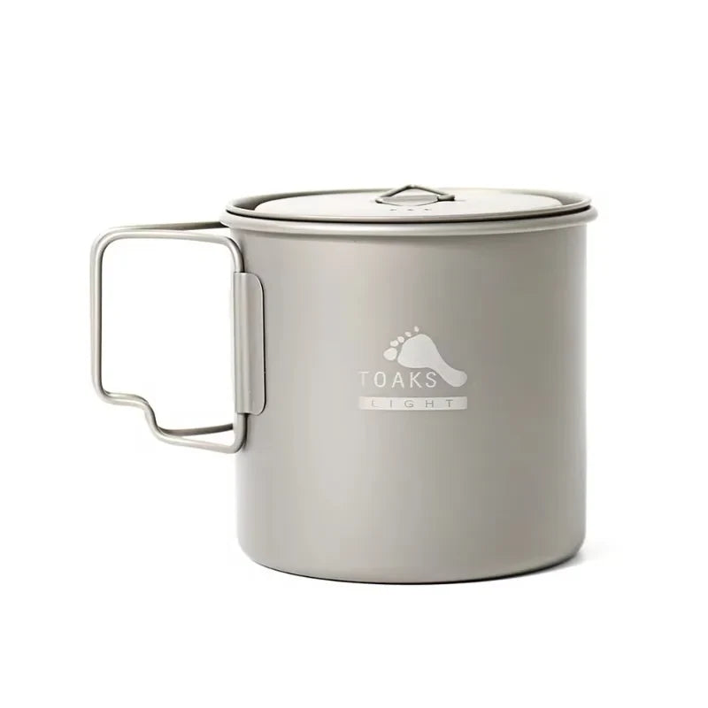 Metal camping mug with handle on a white background