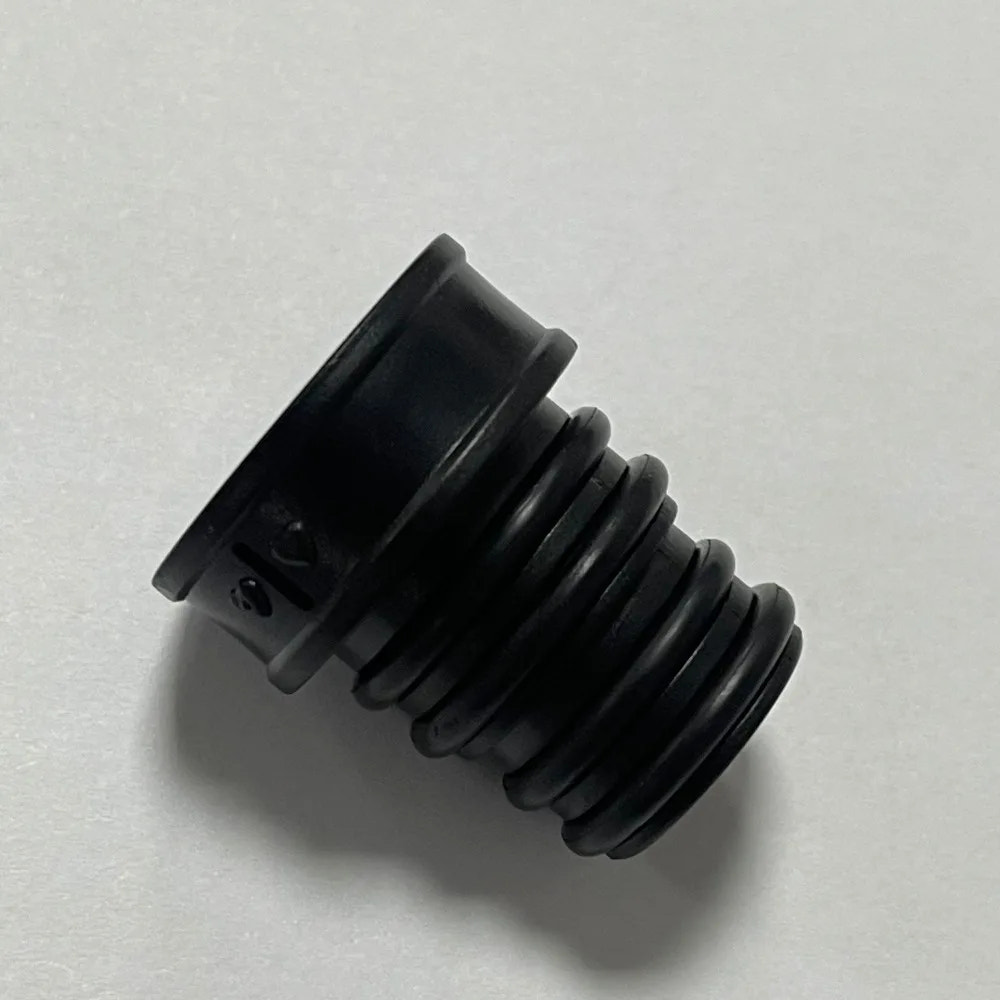 Black rubber grommet on a light gray background