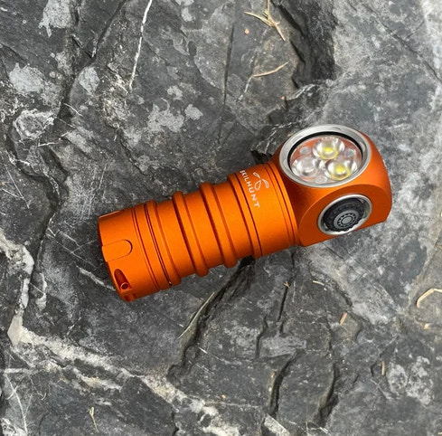 Orange flashlight on a rocky surface