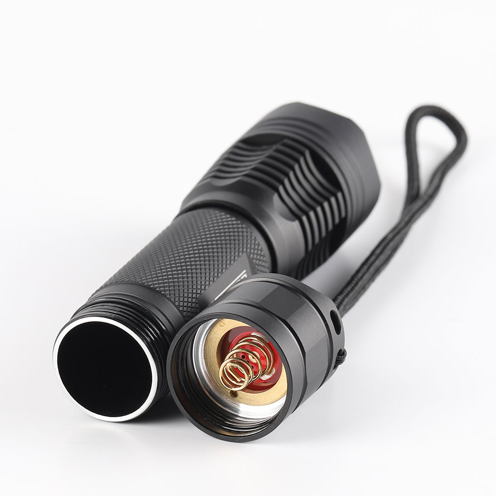 Black flashlight with detailed design on a white background