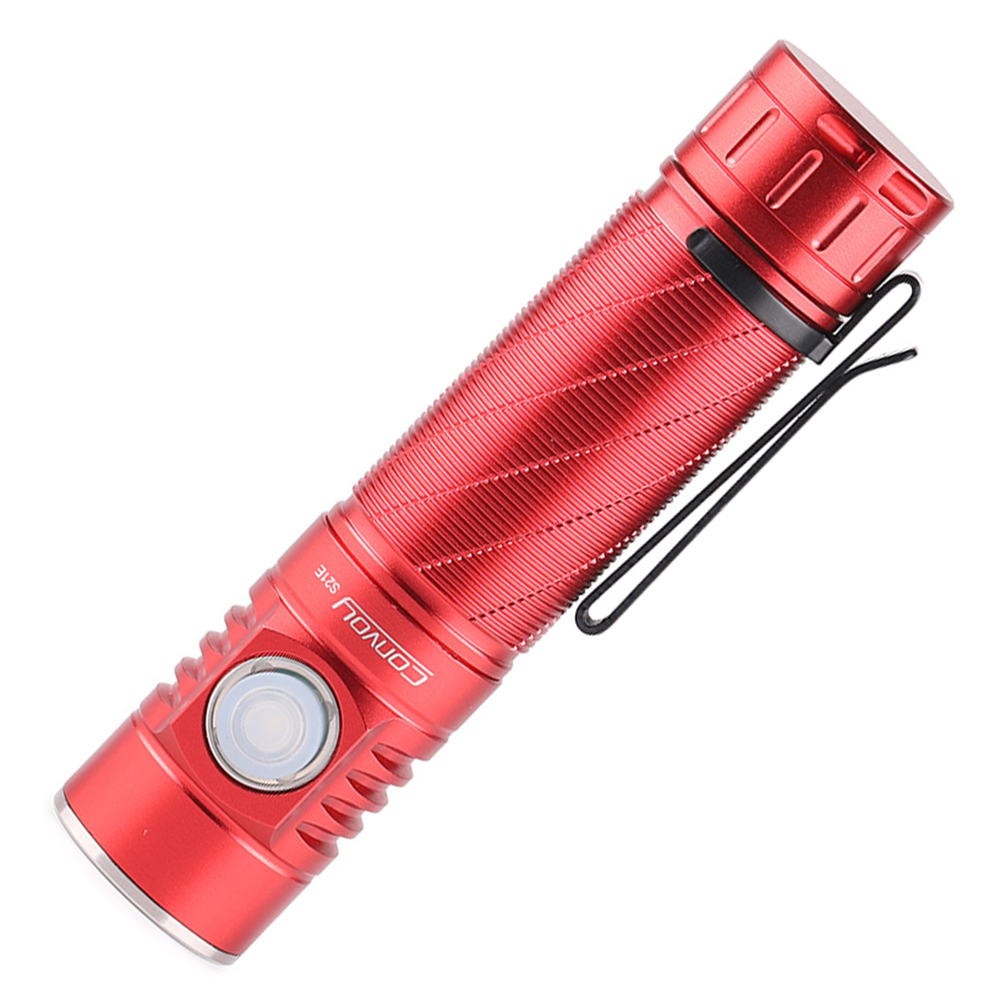 Red flashlight with a textured surface on a white background