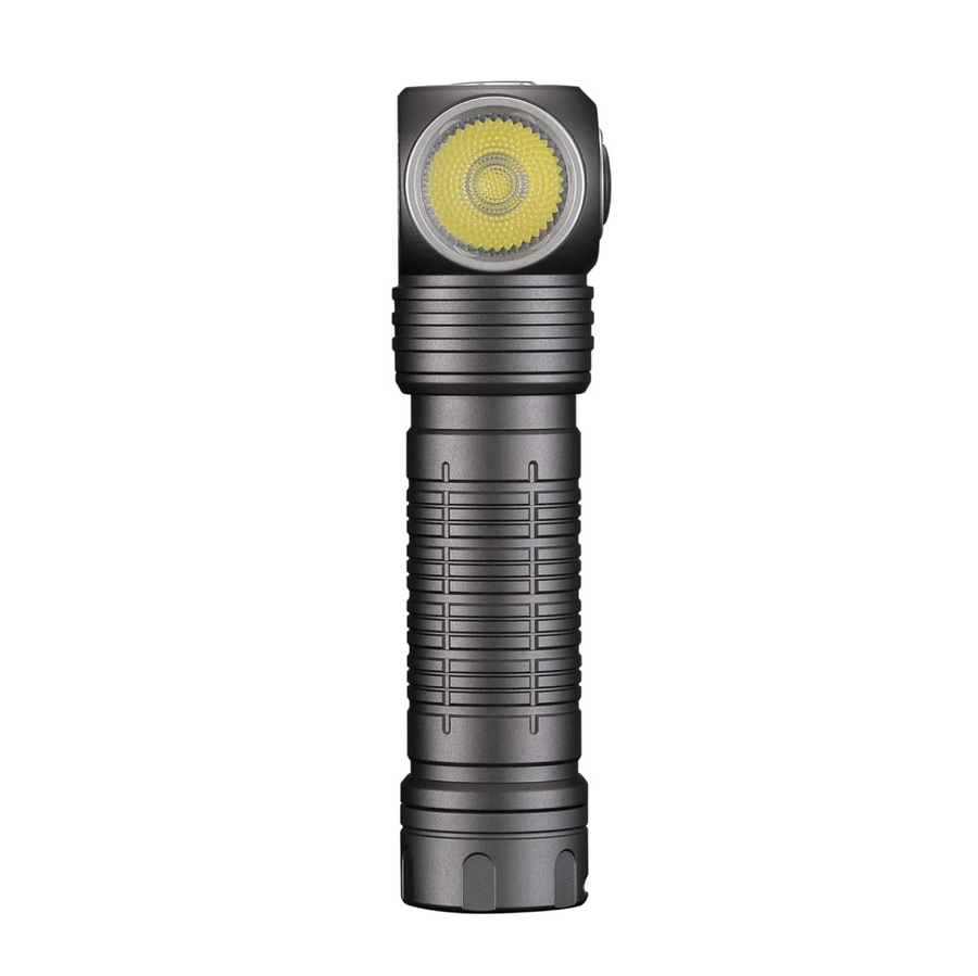 Black flashlight with a yellow light on a white background