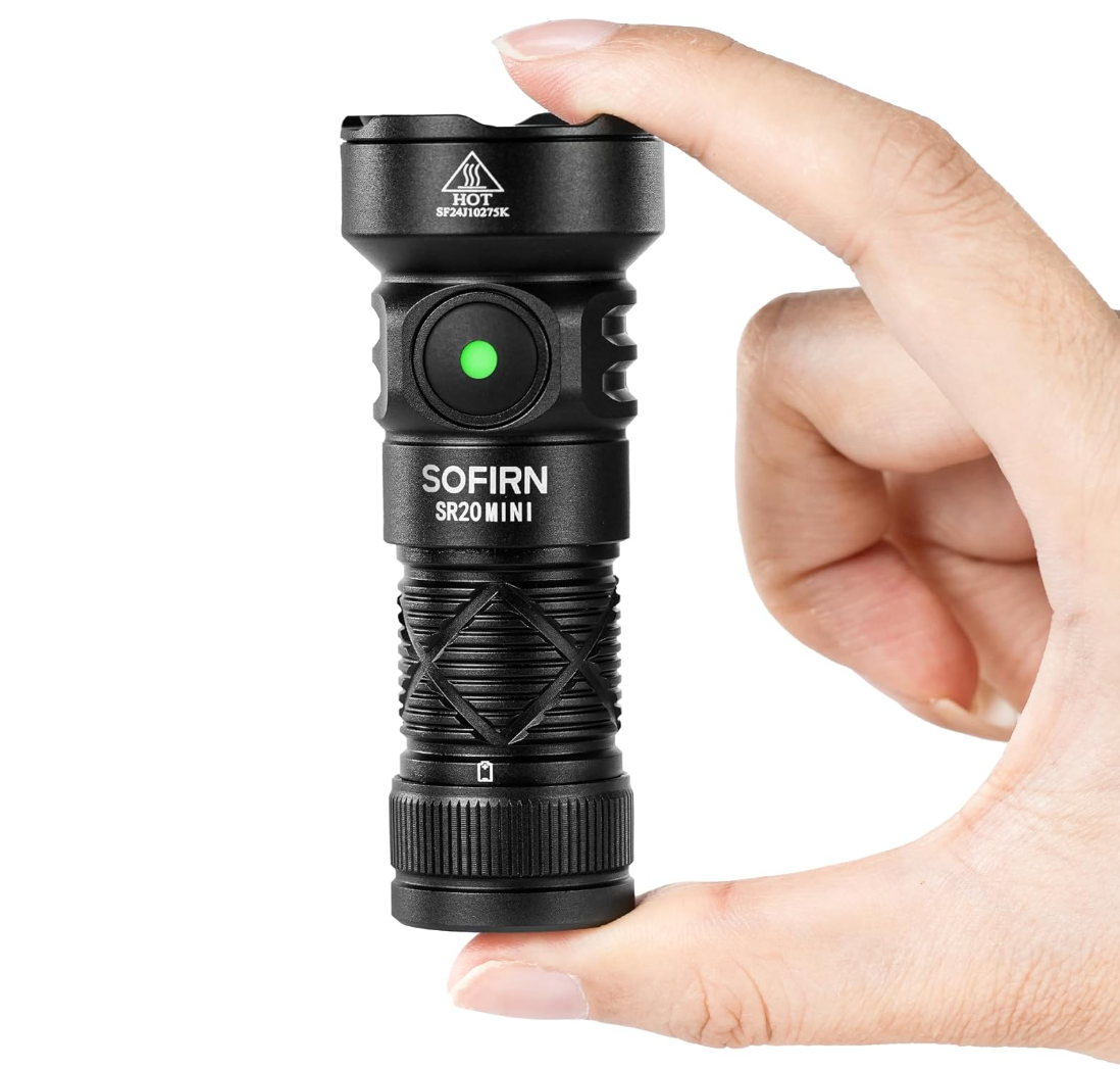 Black flashlight with 'SOFIRN' branding held by a hand on a white background
